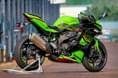 The Ninja ZX4RR gets riding modes, traction control and a bidirectional quickshifter. Kawasaki Ninja ZX4RR rear right static image on track